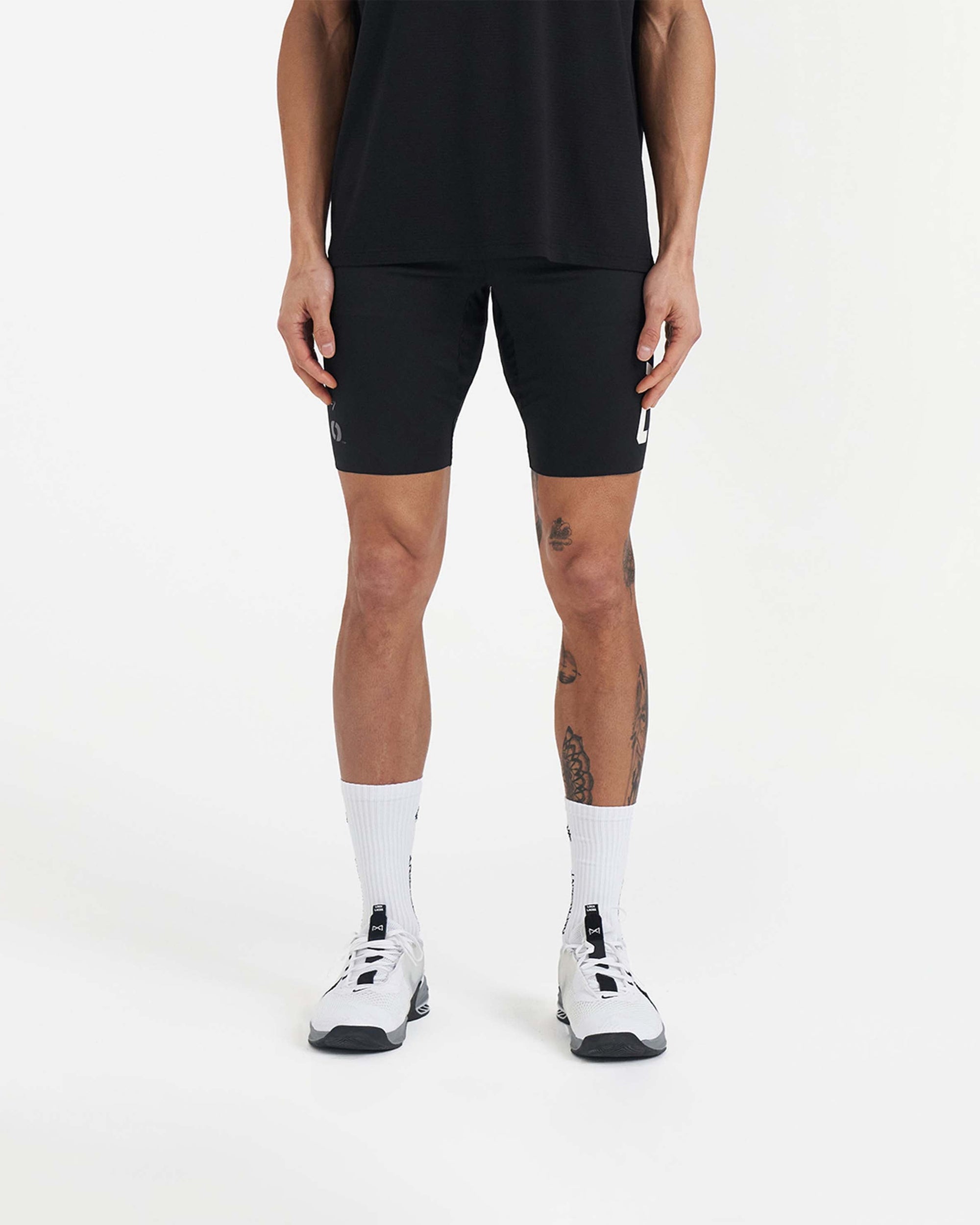 Back product image of mens black base layer shorts on a plain white background | Team 247 Half Tight x Marchon in Black | Base layer shorts with breathable fabric | 247 Shorts | Represent Clo