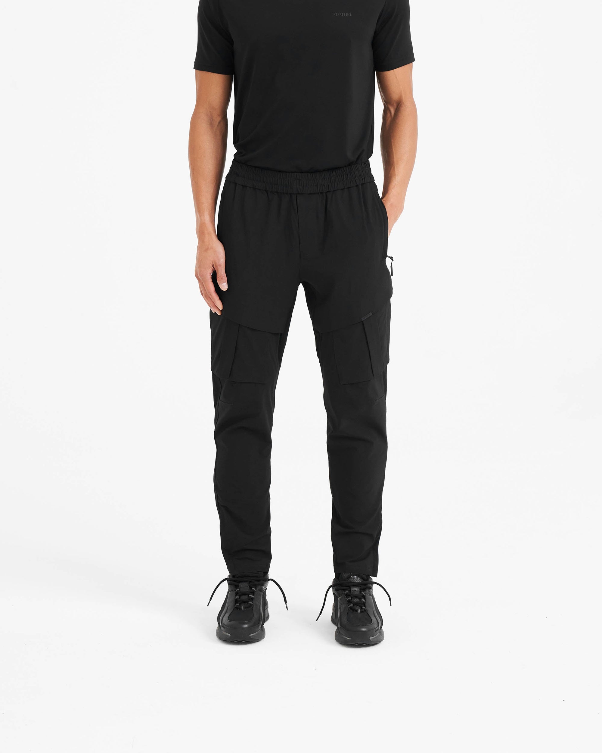 Back product image of mens black pants on a plain white background | 247 Hiking Pant in Black | Cargo style pants with tactical hardware | 247 Pants | Represent Clo