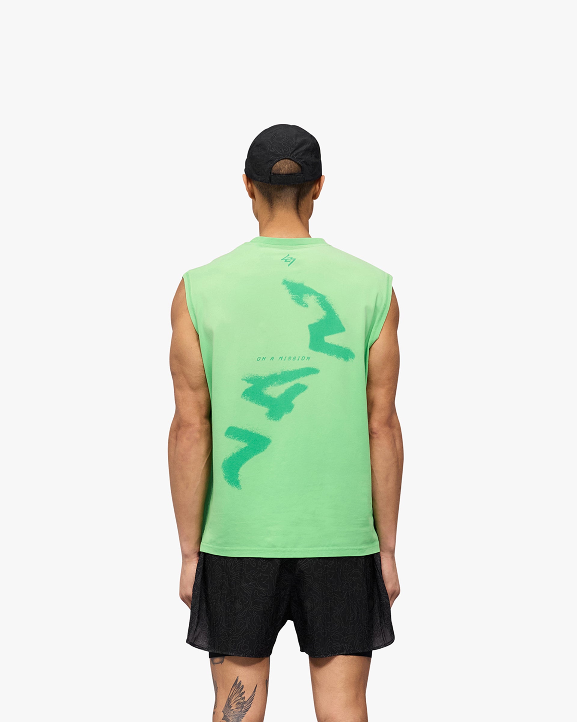Man wearing a green tank top on a plain white background | 247 Motion Oversized Tank in Speed Green | Oversized tank with sweat wicking capability | 247 T-Shirts | Represent Clo