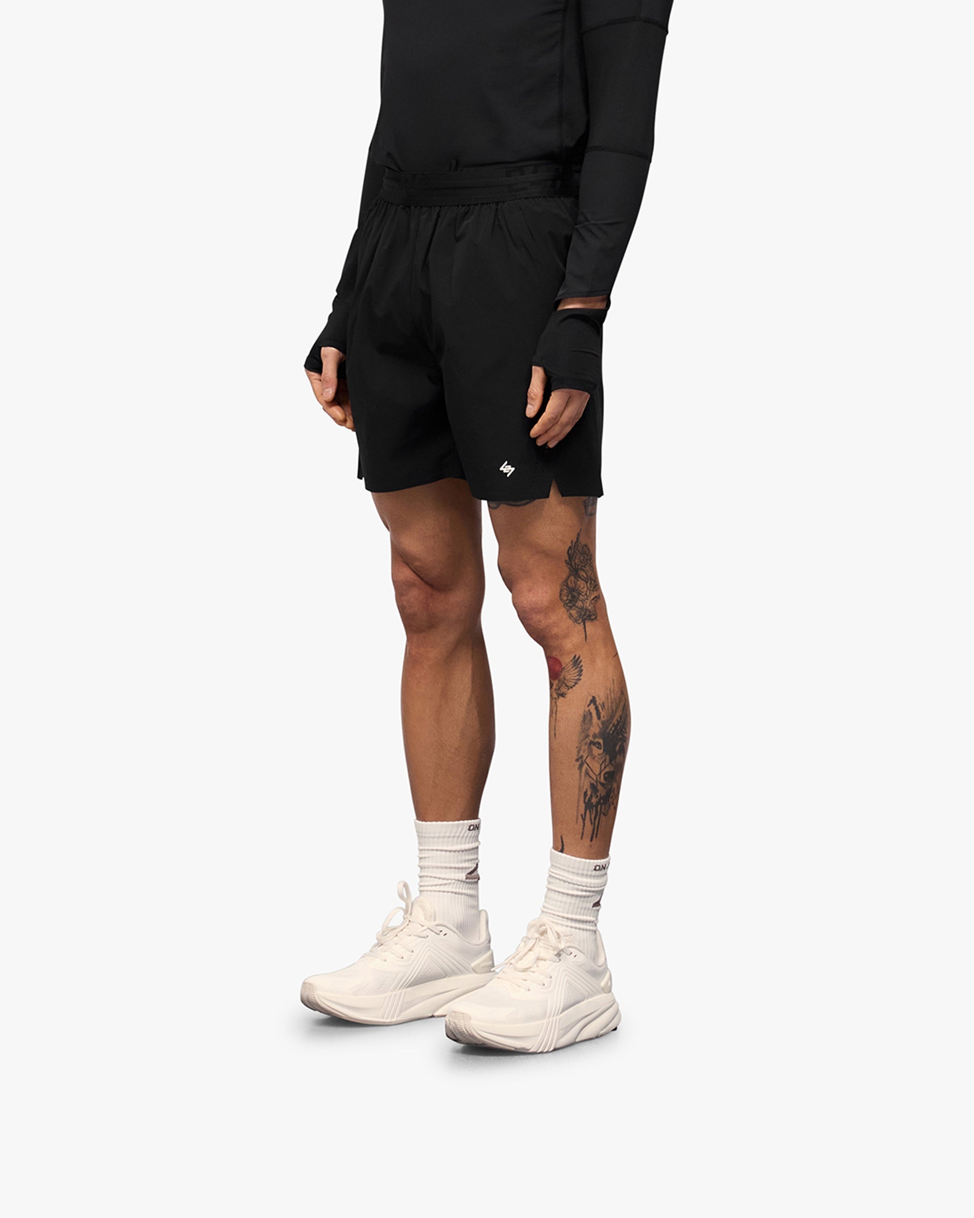 Back product image of mens black training shorts on a plain white background | 247 Training Shorts in Black | High intensity shorts with perforation detailing and zip pockets | 247 Shorts | Represent Clo