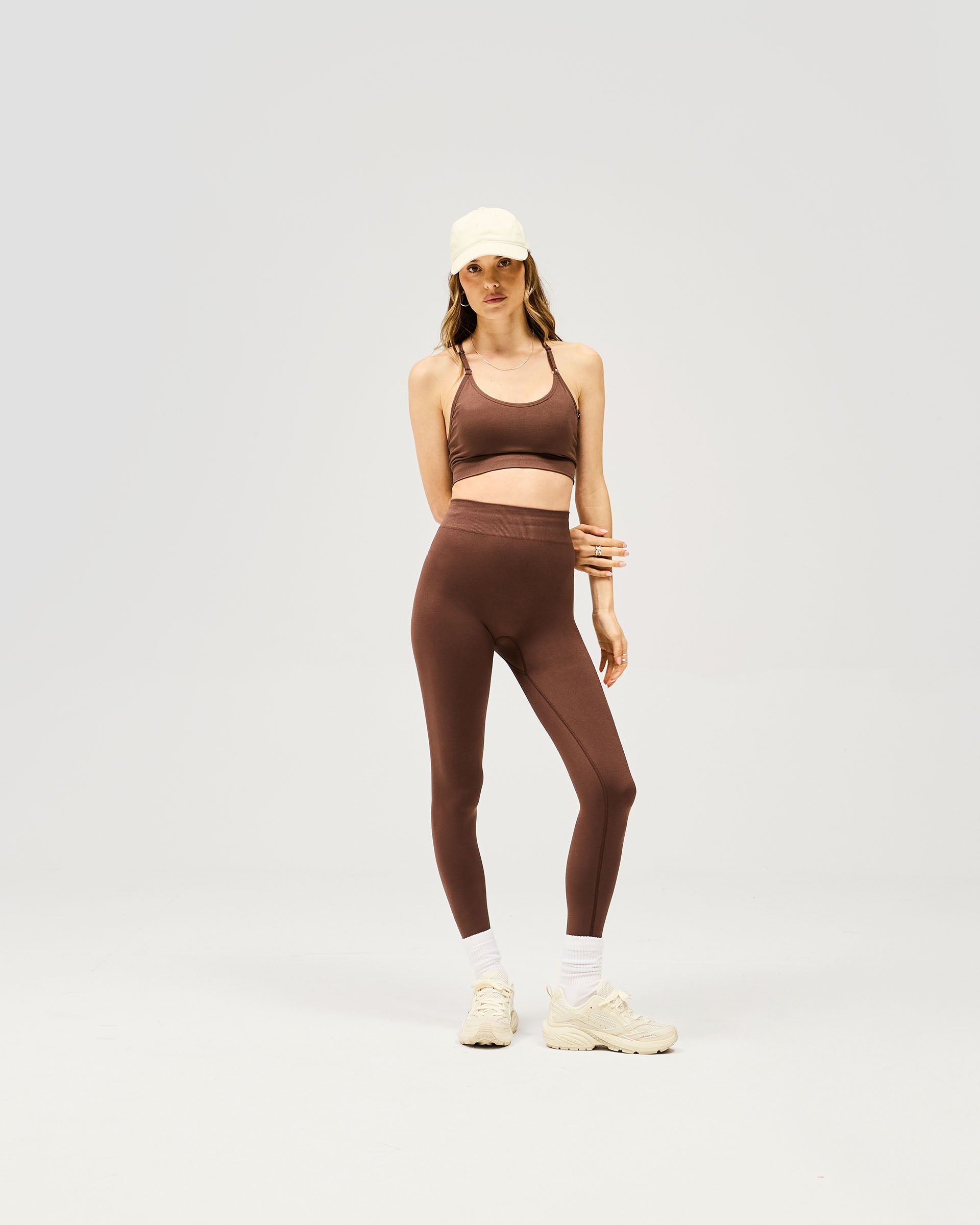 Back product image of womens mocha leggings on a plain white background | Owners Club Contour Seamless Legging in Mocha | High waisted seamless bottoms with discreet contouring | Womens Bottoms | Represent Clo
