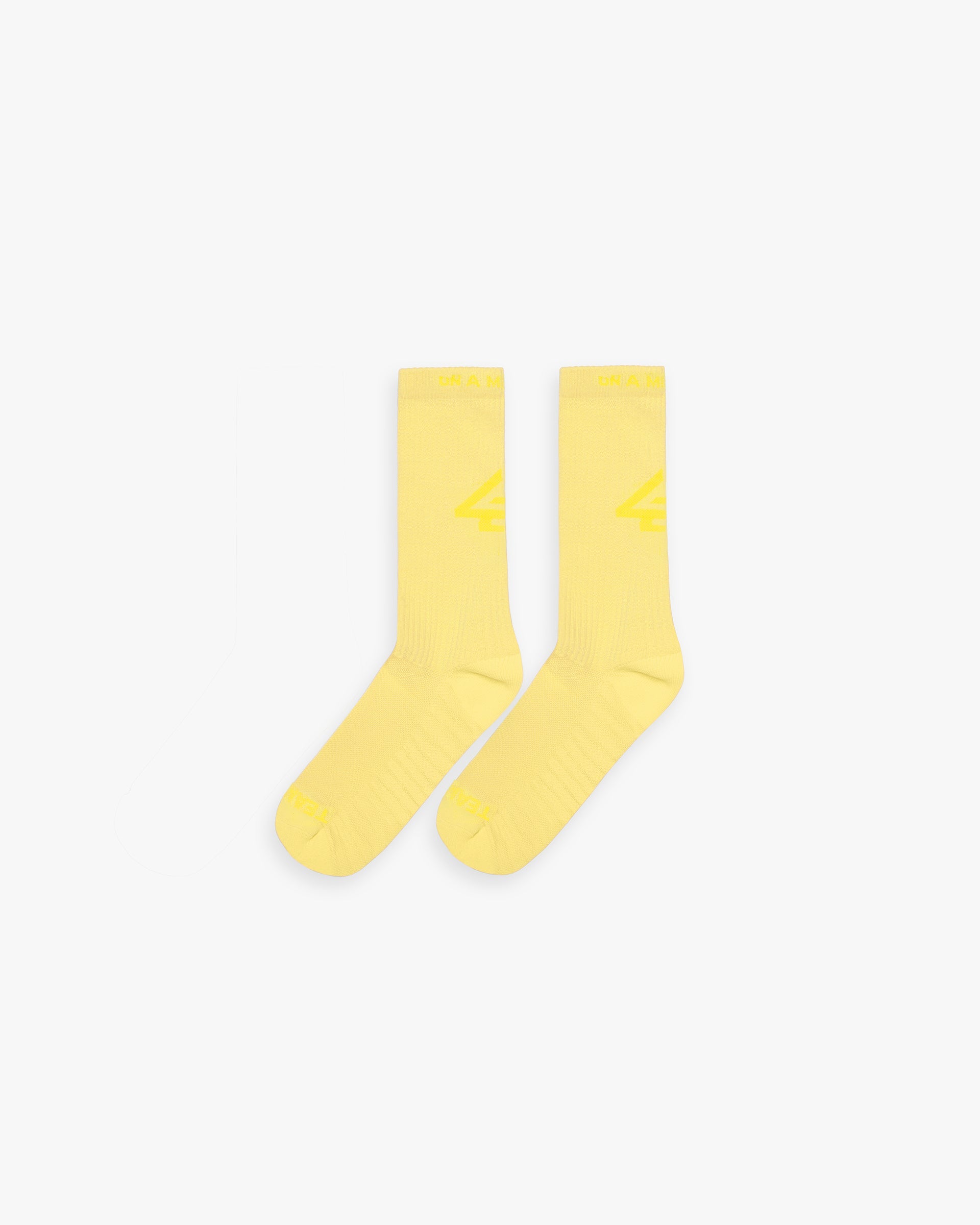 Back product image of mens yellow socks on a plain white background | 247 Logo Socks in Lemon | Yellow training socks with 247 and On A Mission logos | 247 Accessories | Represent Clo