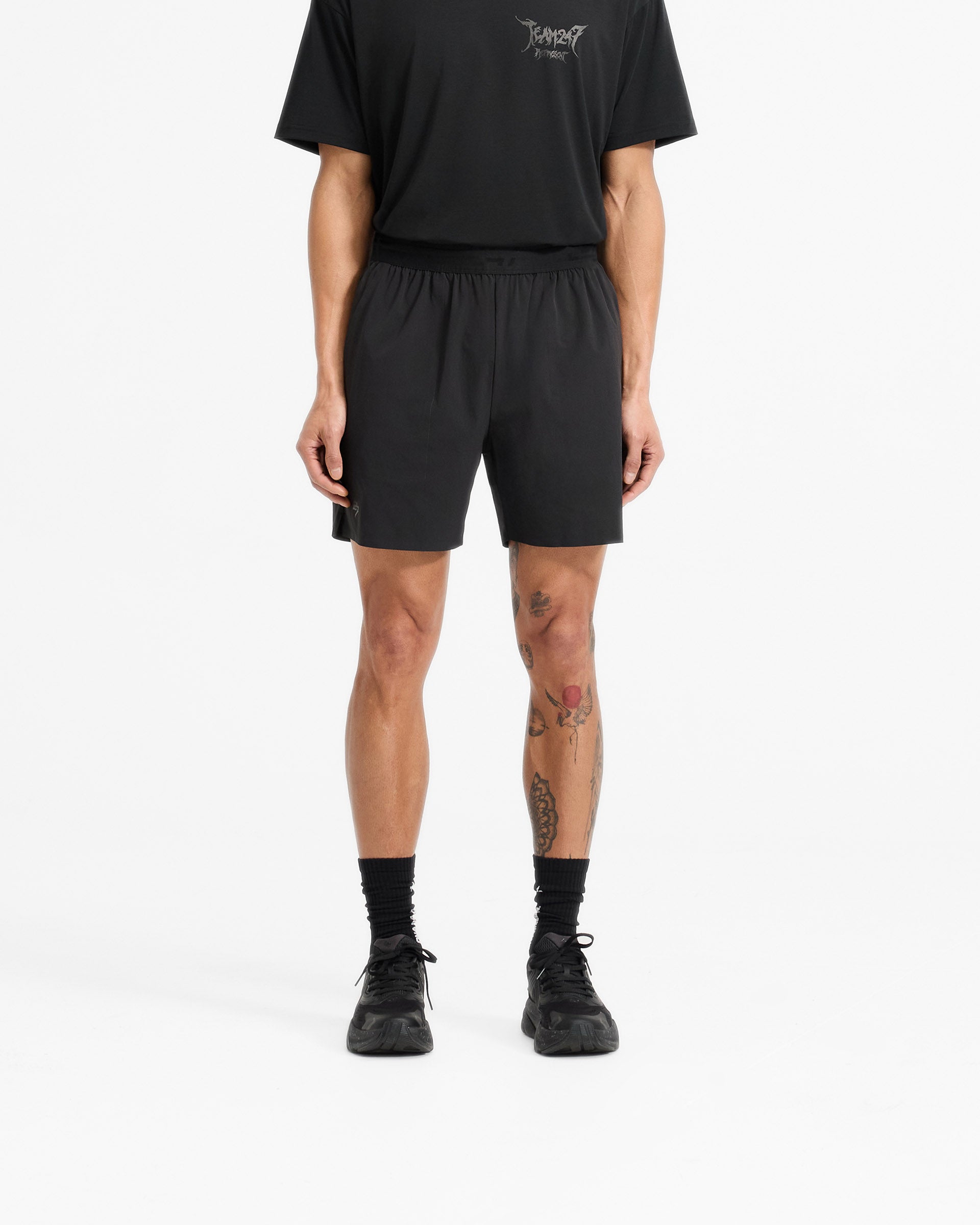 Man wearing black shorts on a plain white background | Team 247 X END Fused Short in Jet Black | Durable shorts with 4-way stretch and exclusive branding | 247 Shorts | Represent Clo